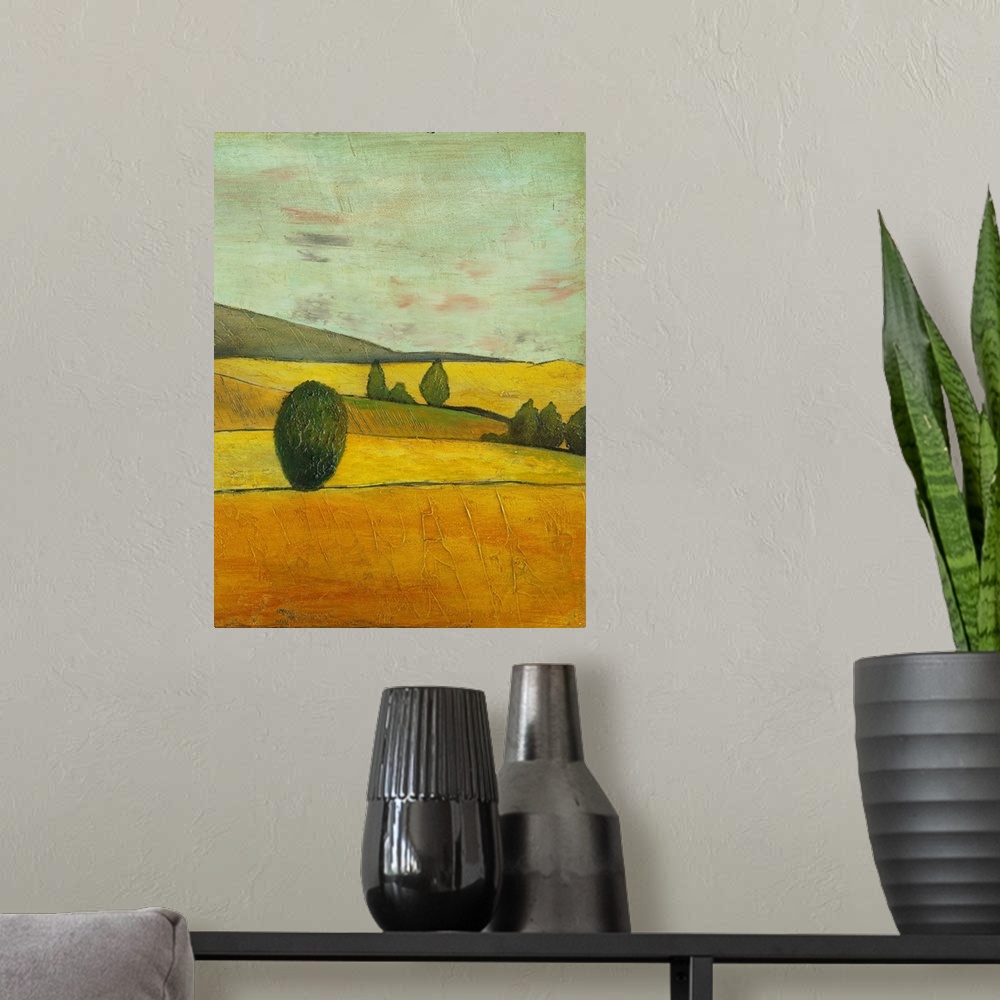 A modern room featuring Contemporary painting of a golden landscape of rolling countryside hills.