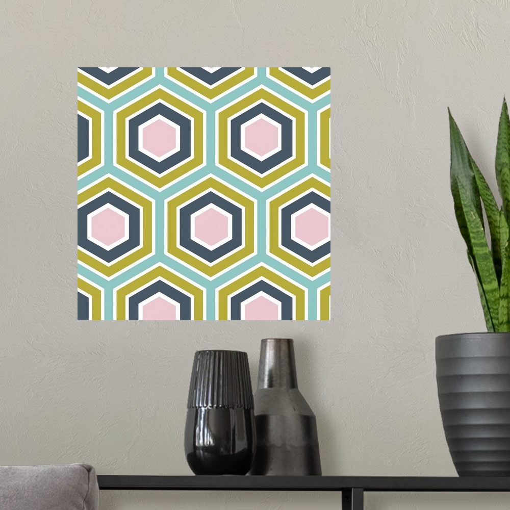 A modern room featuring Geometric artwork of hexagons in bright, summer tones.