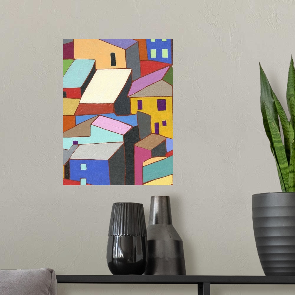A modern room featuring Painting of colorful buildings and rooftops.