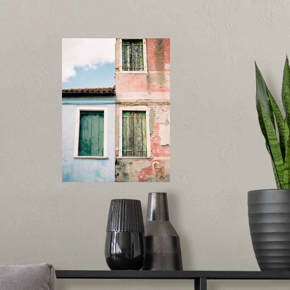 A modern room featuring Photograph of old windows with wooden shutters, Burano, Italy.