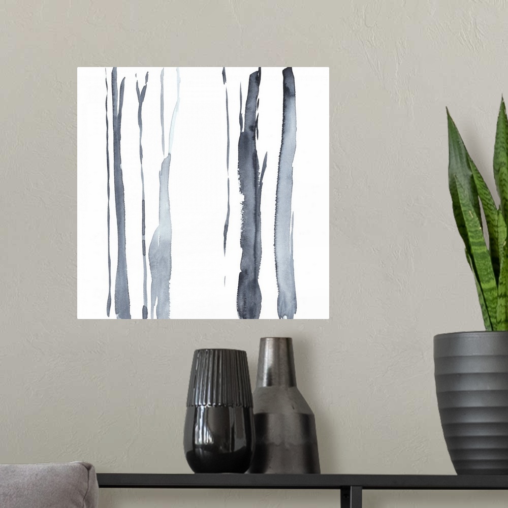 A modern room featuring Square watercolor painting of abstract tree trunks in gray against a white background.