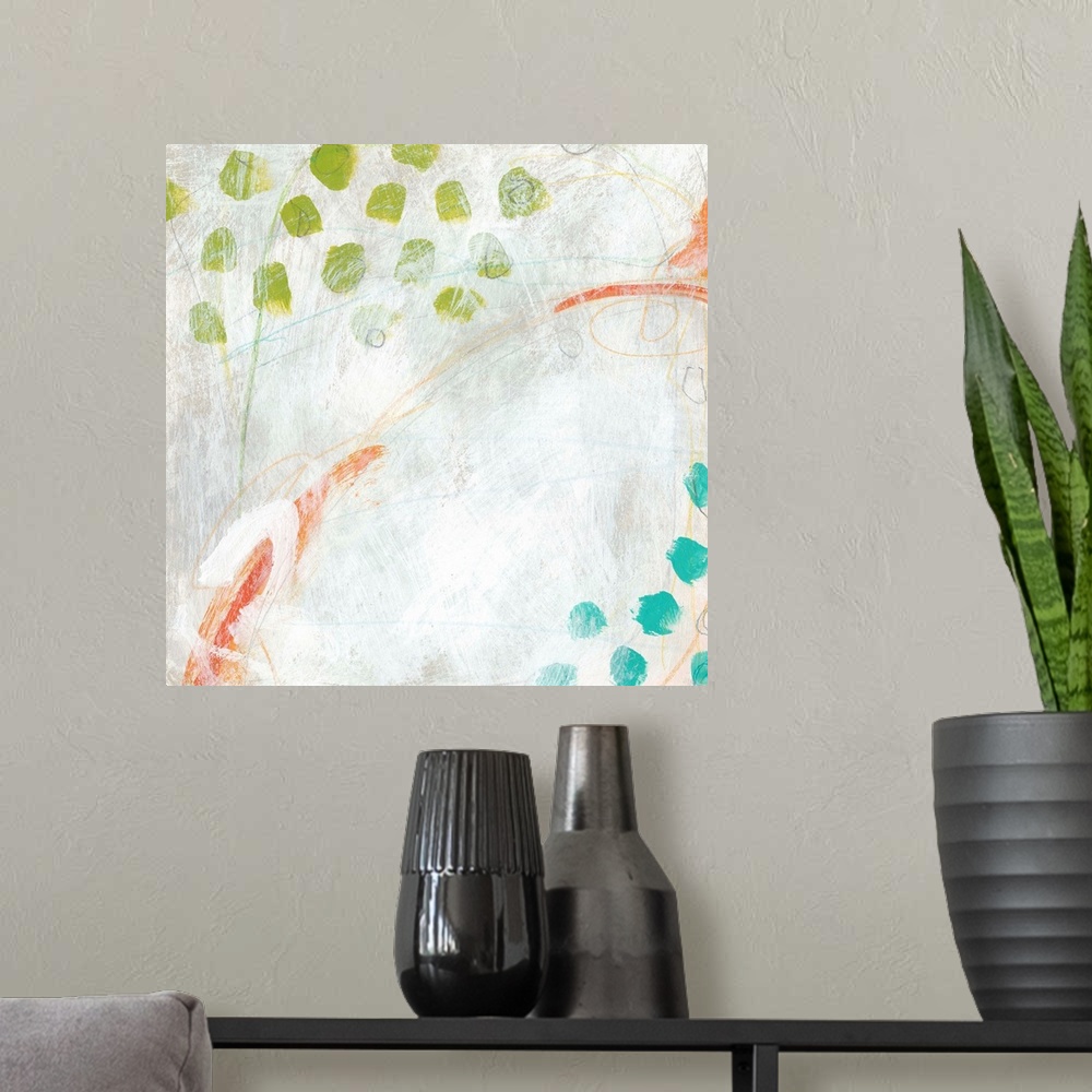 A modern room featuring Abstract painting with bright blue and green dots on a pale background.