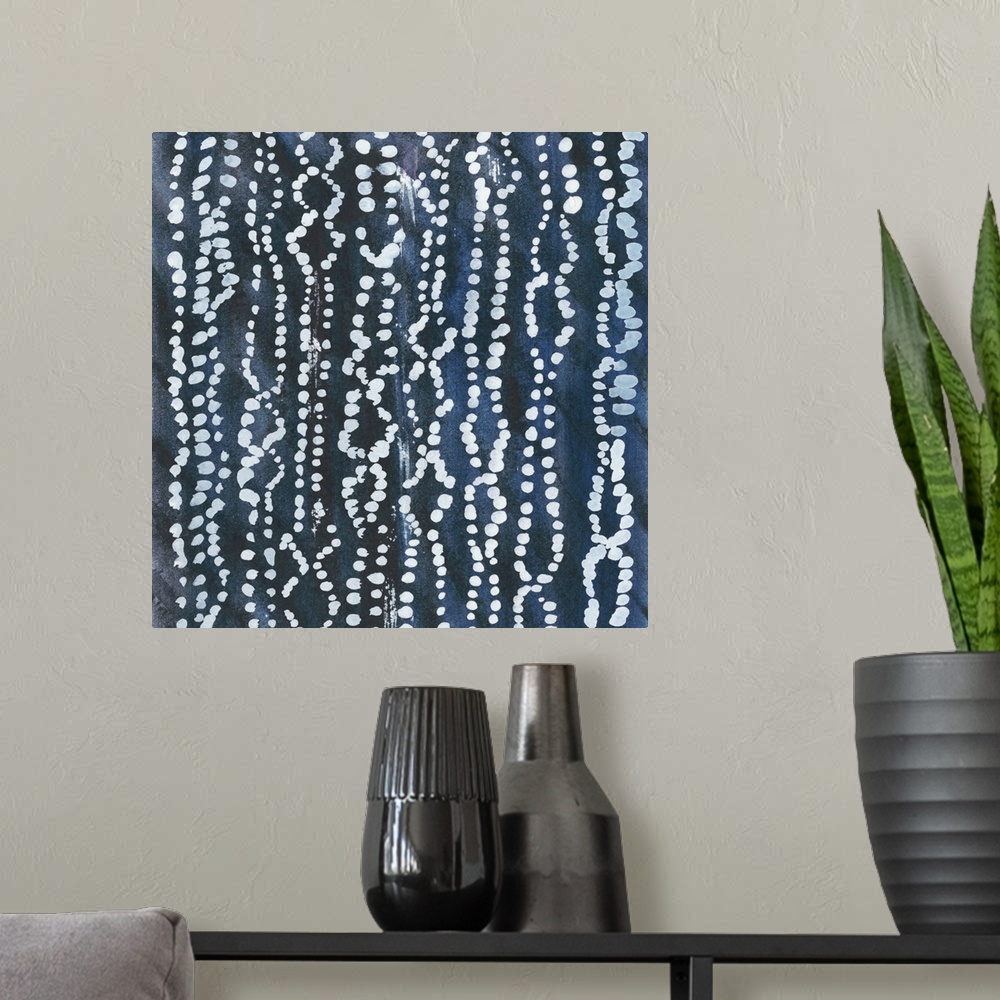 A modern room featuring Abstract art with a dark blue background and circular designs in lines on top in gray.