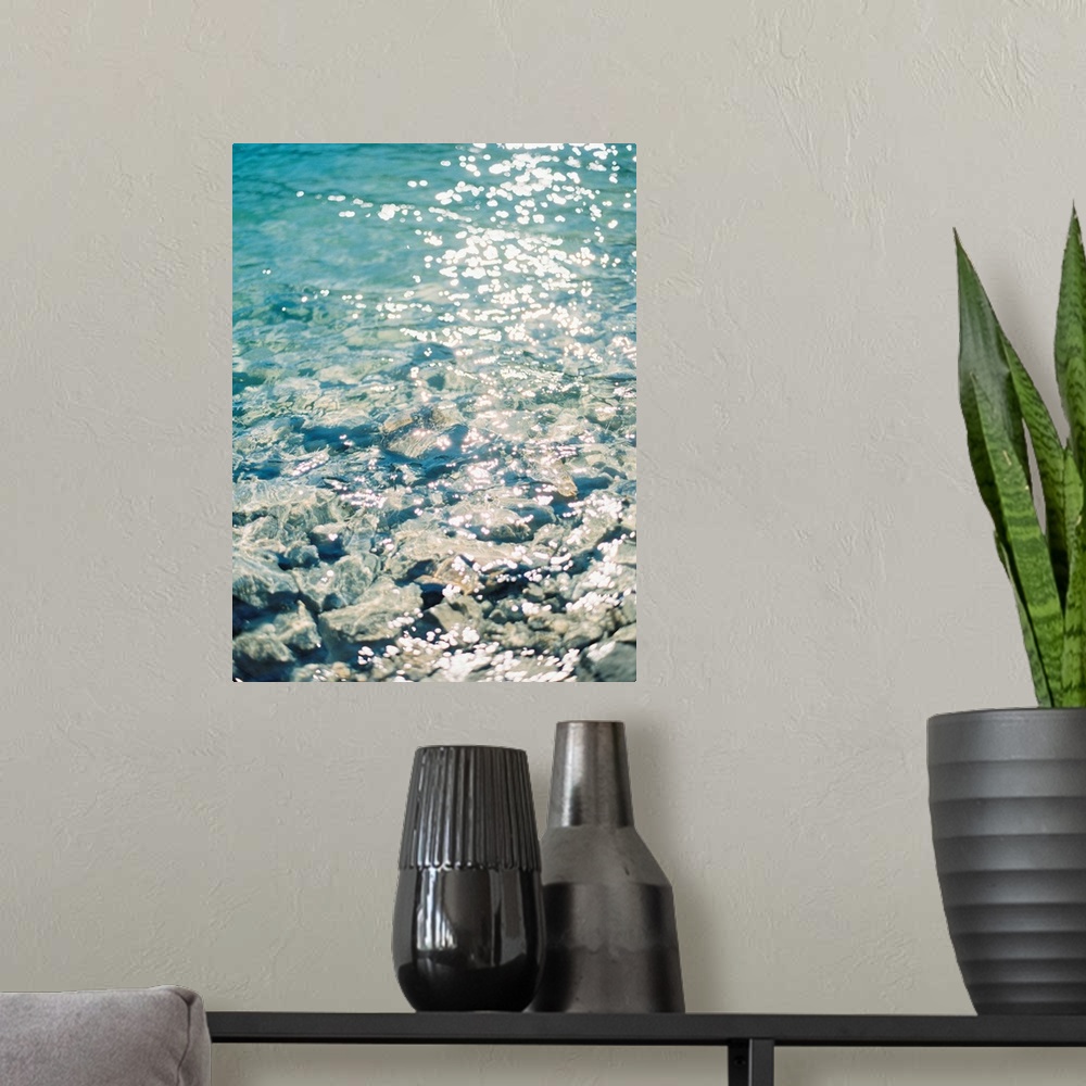 A modern room featuring Photograph of sunlight reflecting off of clear blue water, Canmore, Canada.