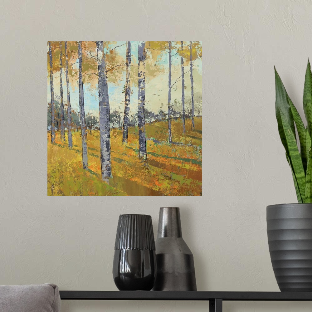 A modern room featuring Painting of trees casting shadows in a countryside clearing in autumn.
