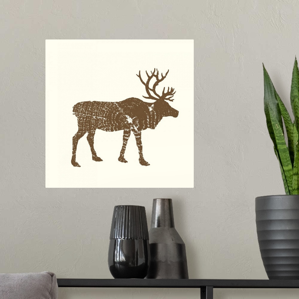A modern room featuring Contemporary cabin decor artwork of a woodland animal silhouettes made up of stamp cross section ...