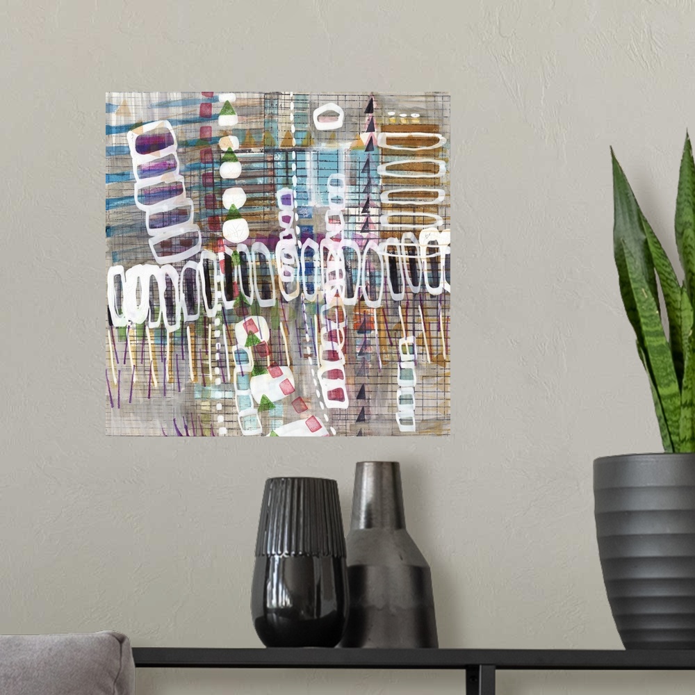 A modern room featuring Square abstract art with layered shapes and lines.