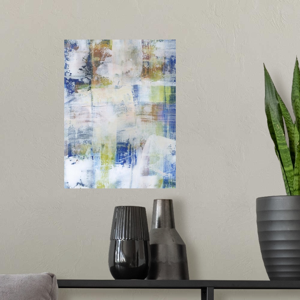 A modern room featuring Contemporary abstract painting using blue tones with faded white in swiping motions.