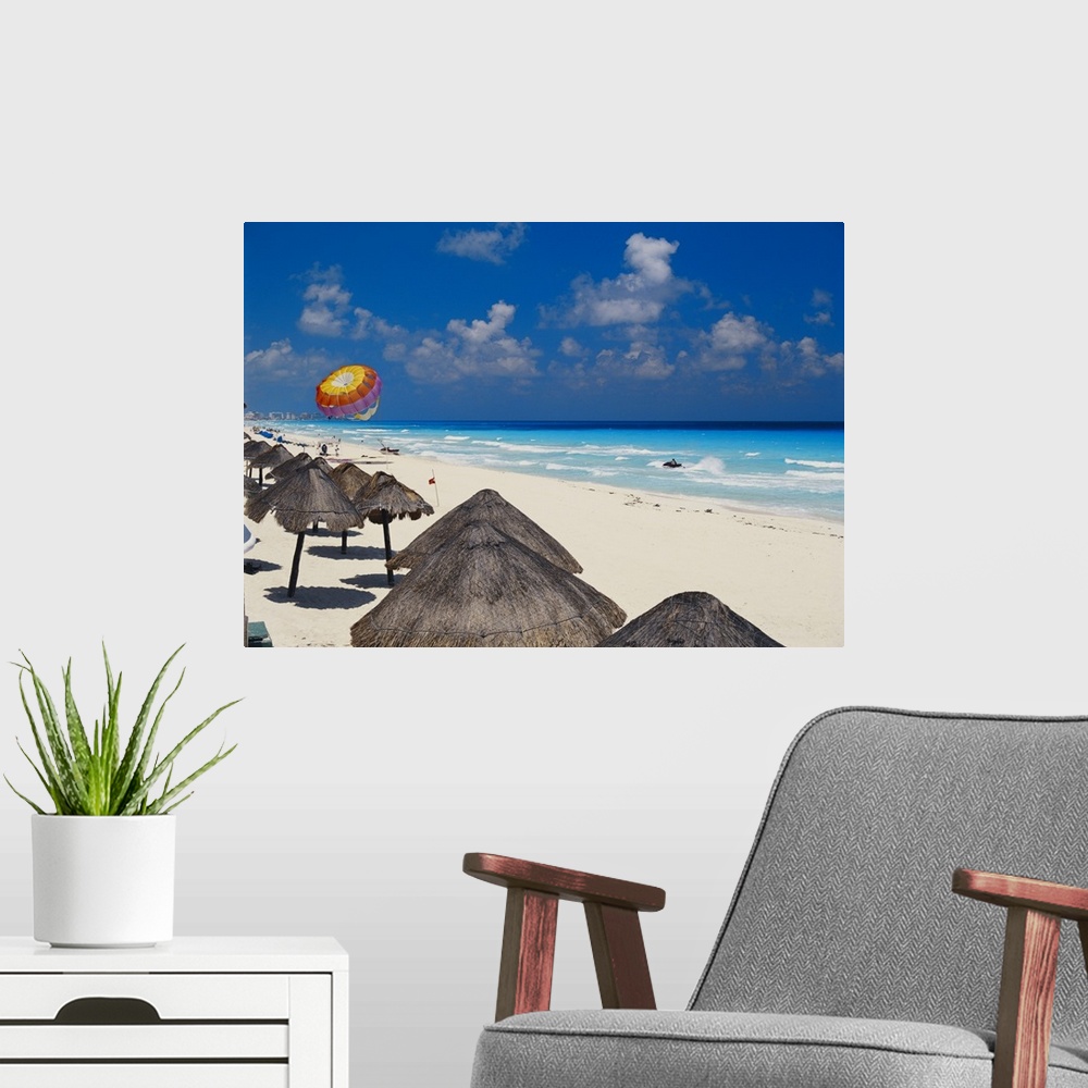 A modern room featuring Mexico, Cancun, sunshades along beach with parachute in background