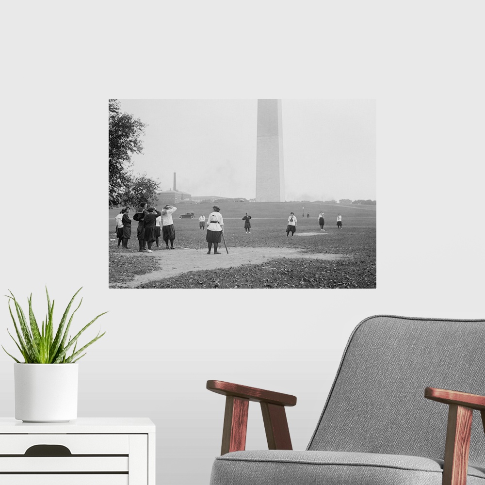 A modern room featuring Young women in bloomers and middy shirts playing baseball on the National Mall. Oct 19, 1919. Was...
