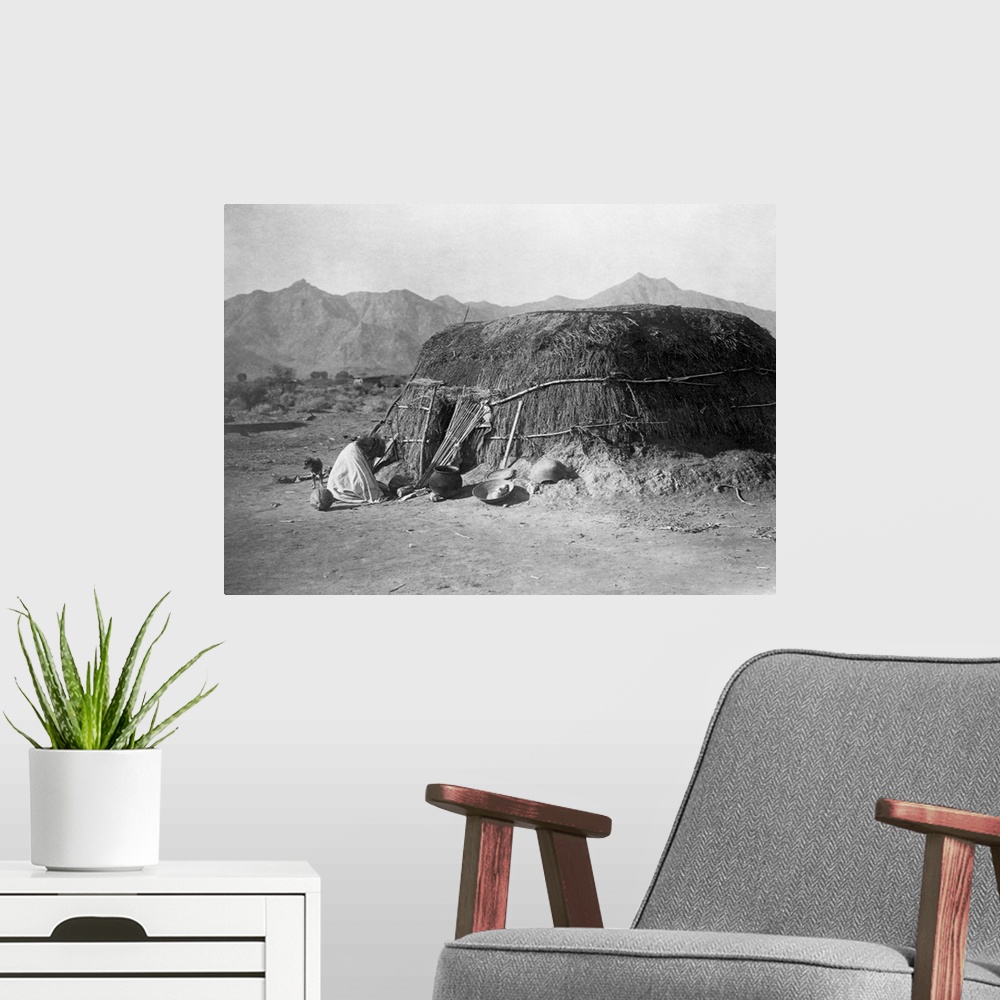 A modern room featuring A photograph of a Pima round dwelling, or ki, published in a portfolio supplementing Volume II of...