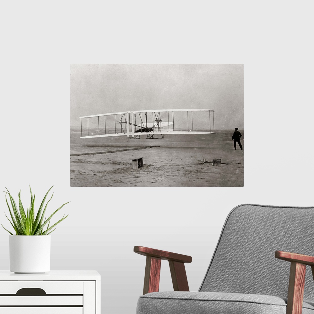 A modern room featuring 1903 Wright Brothers' Plane Taking Off At Kitty Hawk North Carolina USA.