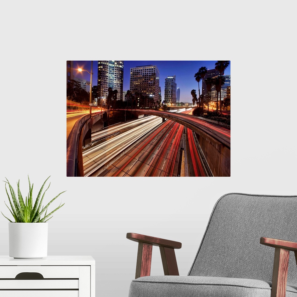 A modern room featuring Car trails at dusk in downtown Los Angeles, California