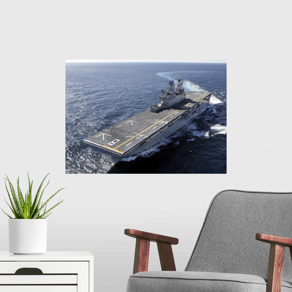 A modern room featuring The amphibious assault ship USS Makin Island in the Gulf of Mexico.