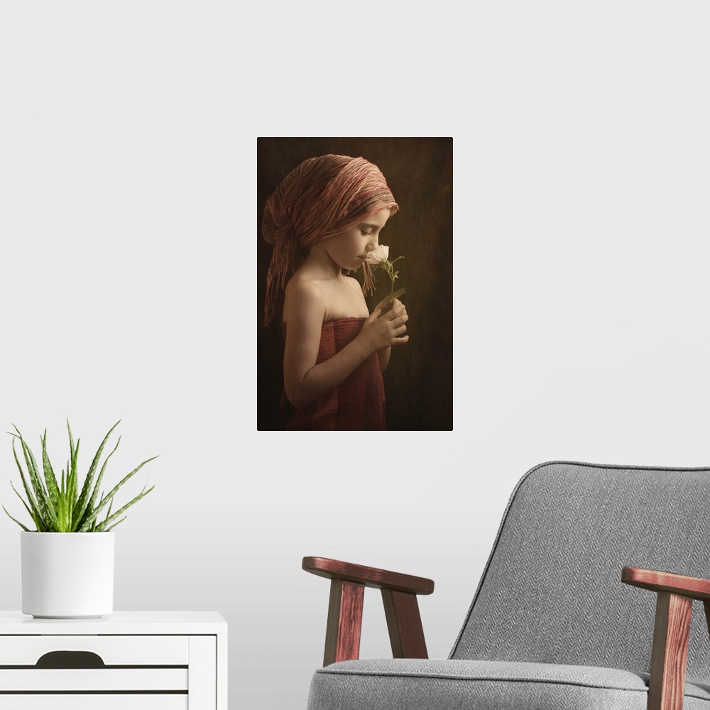 A modern room featuring Portrait of a girl wearing robes smelling a flower.