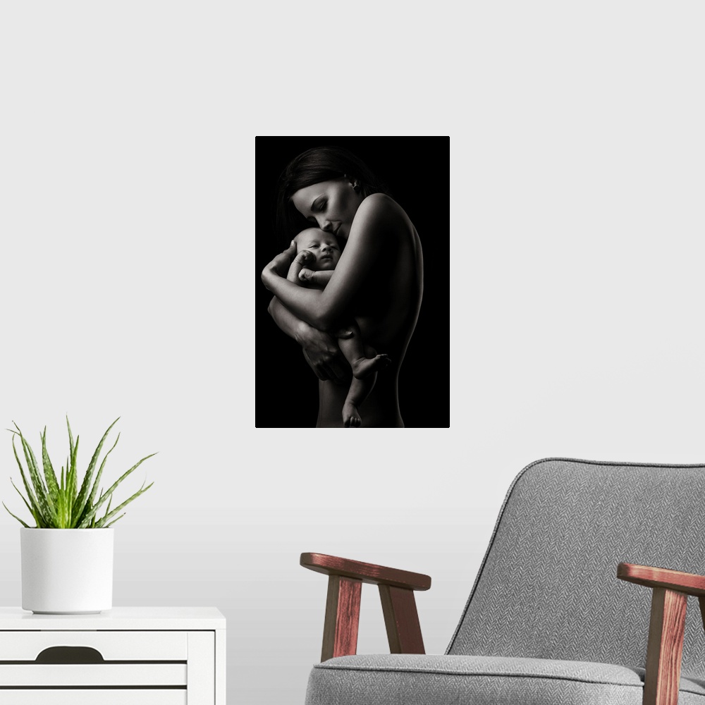 A modern room featuring A fine art photograph of a woman holding her infant child lovingly.