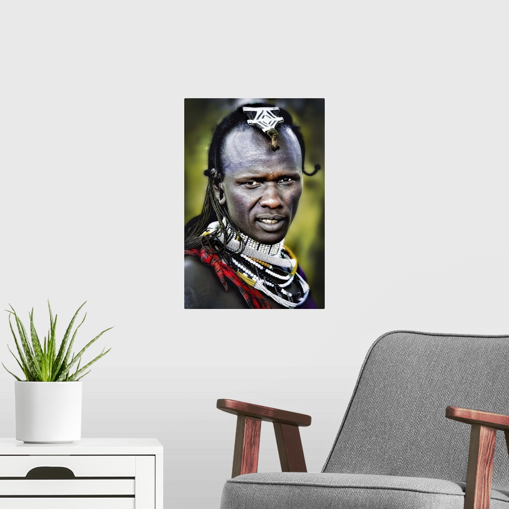 A modern room featuring A man wearing decorative jewelry and headpieces in the Masai Mara area of Tanzania.