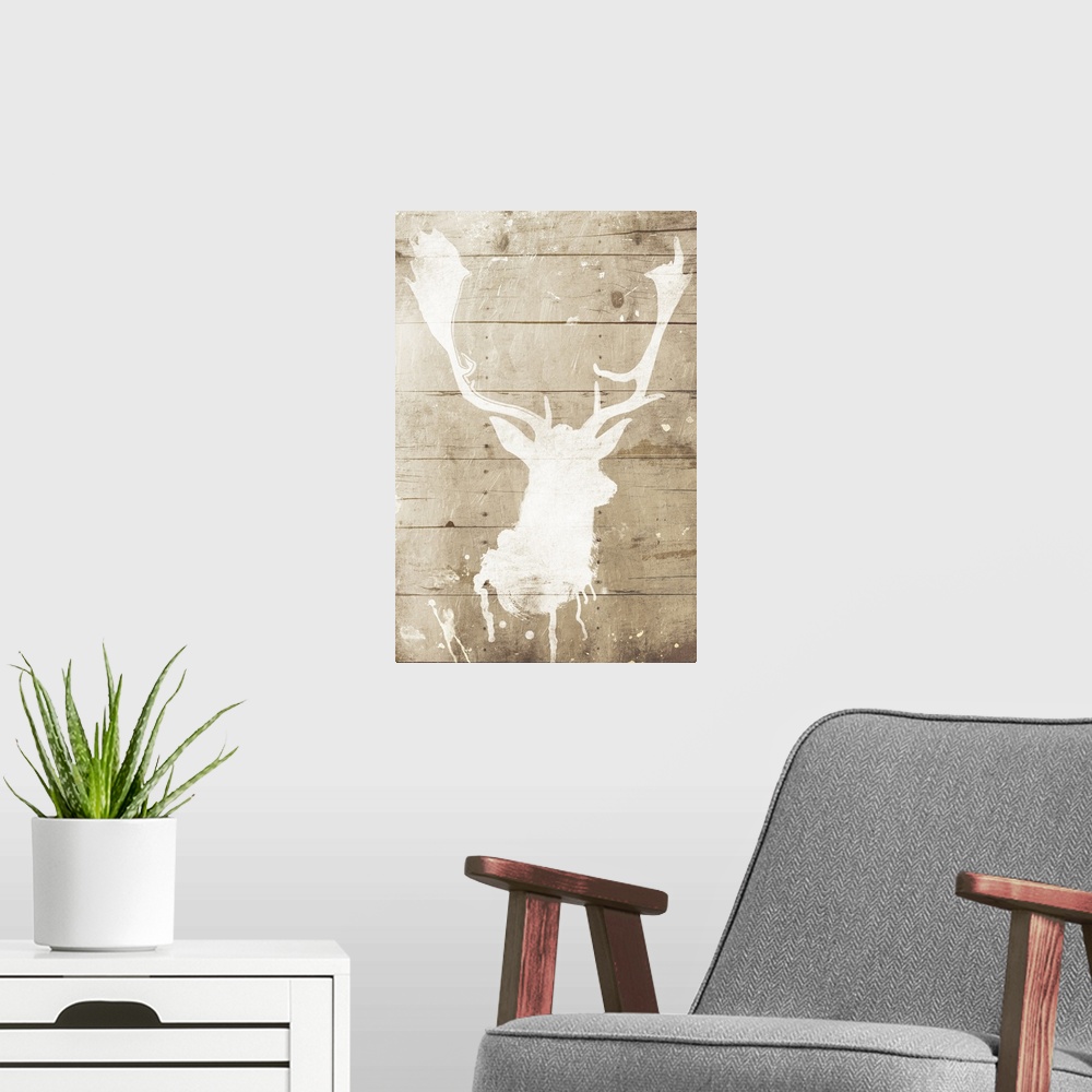 A modern room featuring A white silhouette of a deer painted on a wood background with some paint drips and splatter.