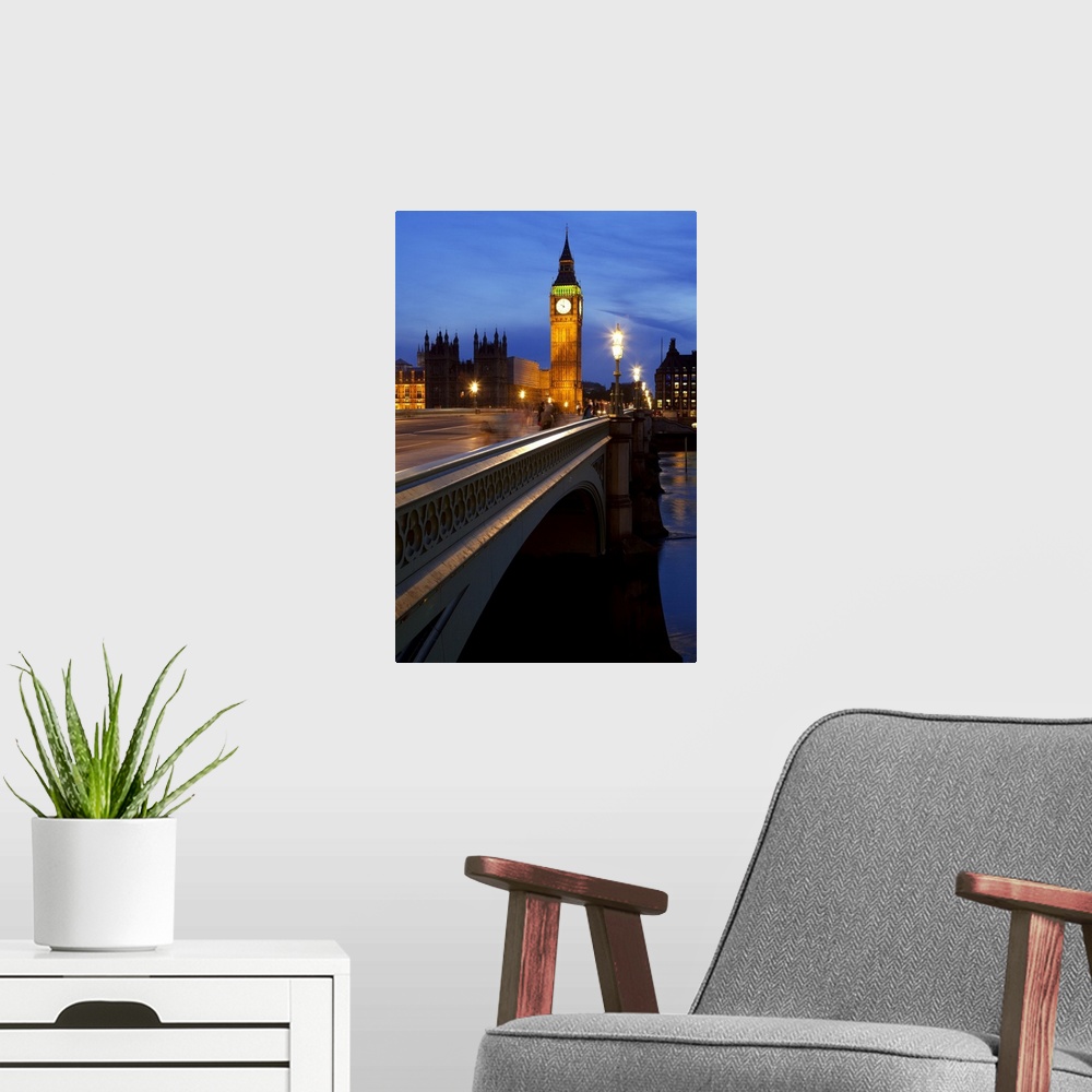 A modern room featuring A night view across Westminster Bridge with Big Ben in the distance.