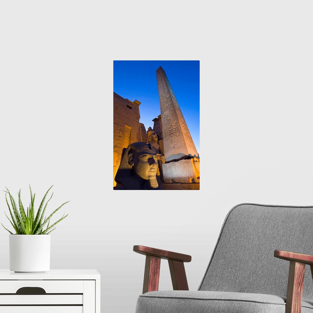 A modern room featuring Large Pharaoh's Head Statue And Obelisk