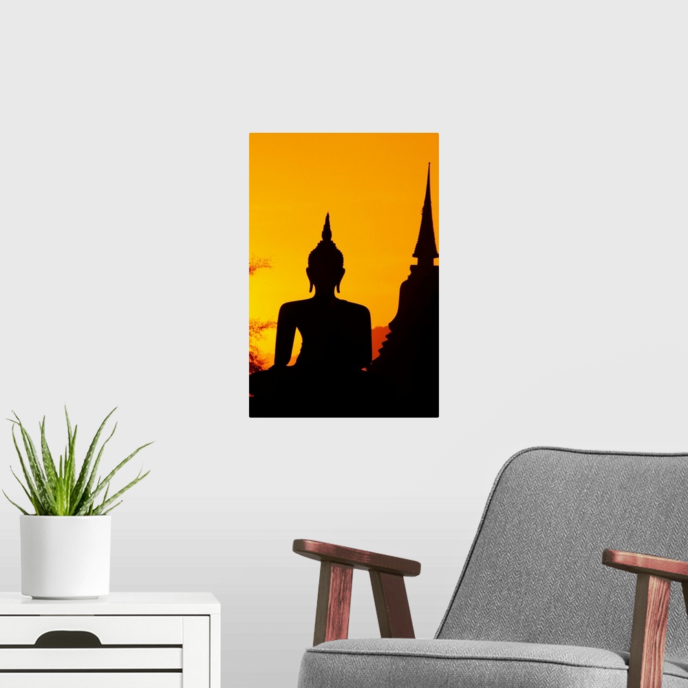 A modern room featuring Thailand, Sukhothai, Buddha And Temple Silhouetted At Sunset