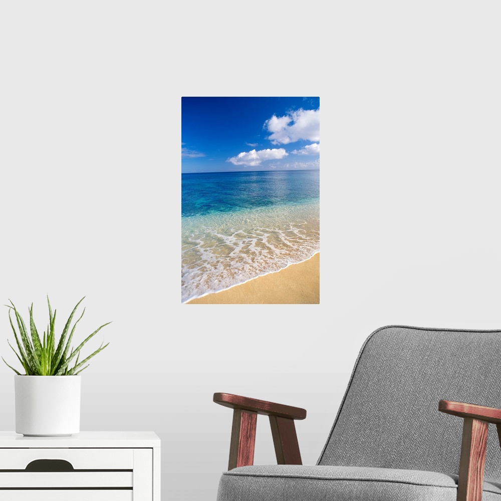 A modern room featuring Wave Washes Ashore Onto Sandy Beach, Azure Ocean, Blue Sky