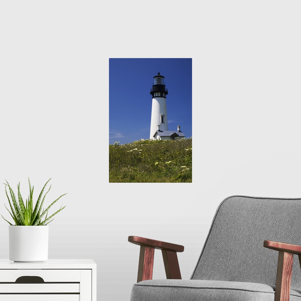 A modern room featuring White Lighthouse With A Blue Sky And Wildflowers; Newport, Oregon, USA