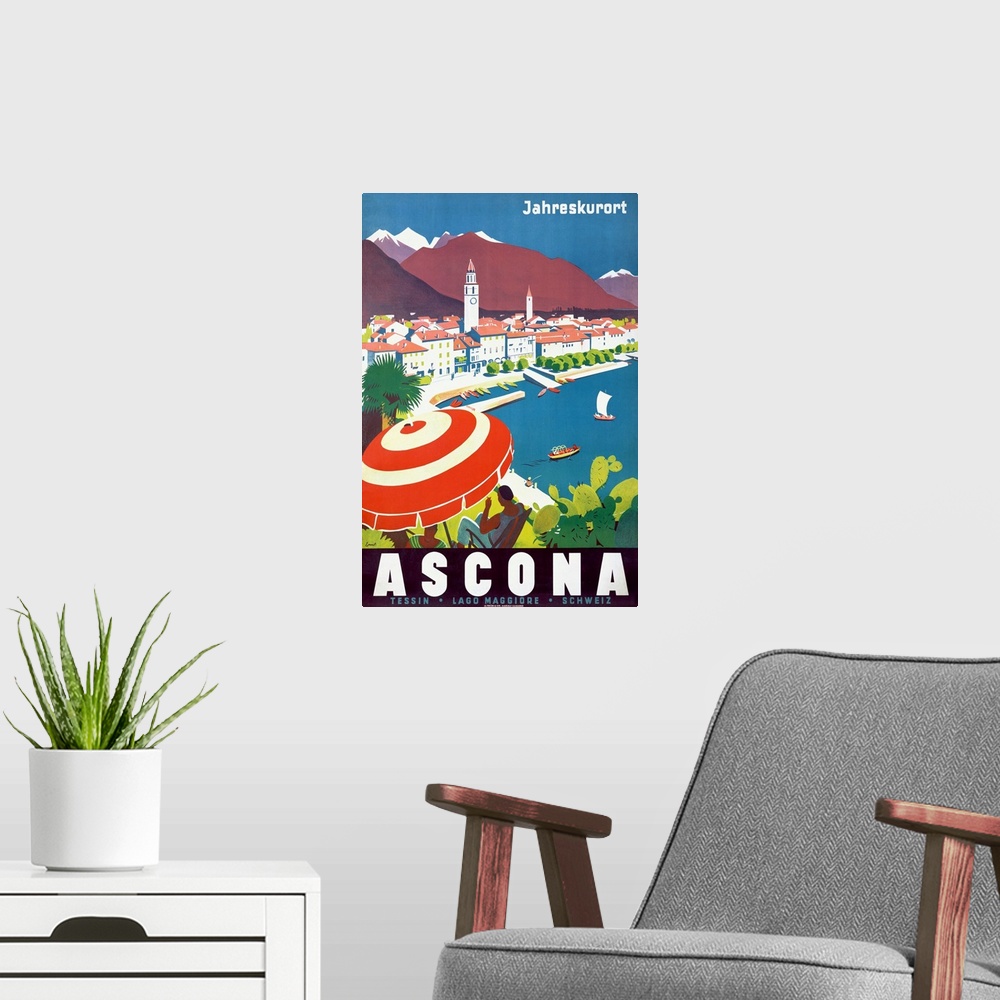 A modern room featuring Vintage poster of a woman sitting under an umbrella on a hill that overlooks a body of water with...