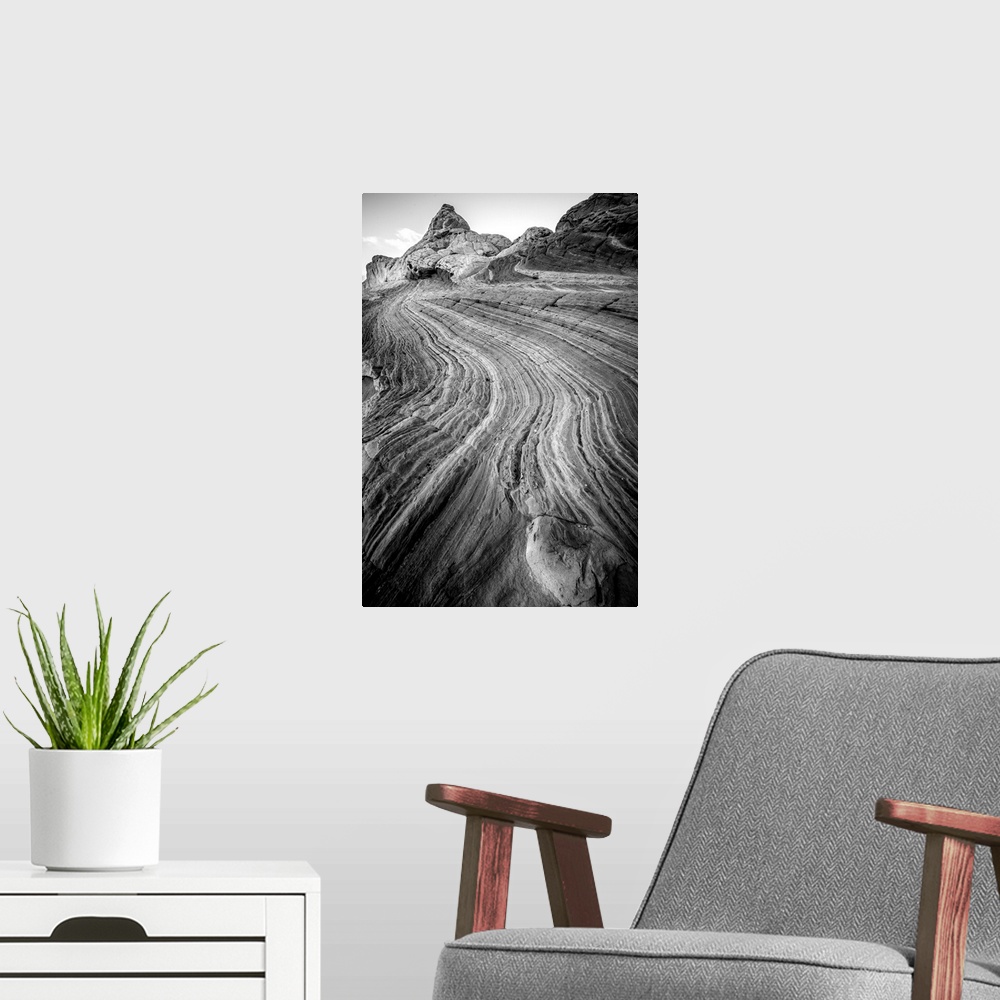 A modern room featuring Black and white photograph highlighting the textures from the layers of rock.