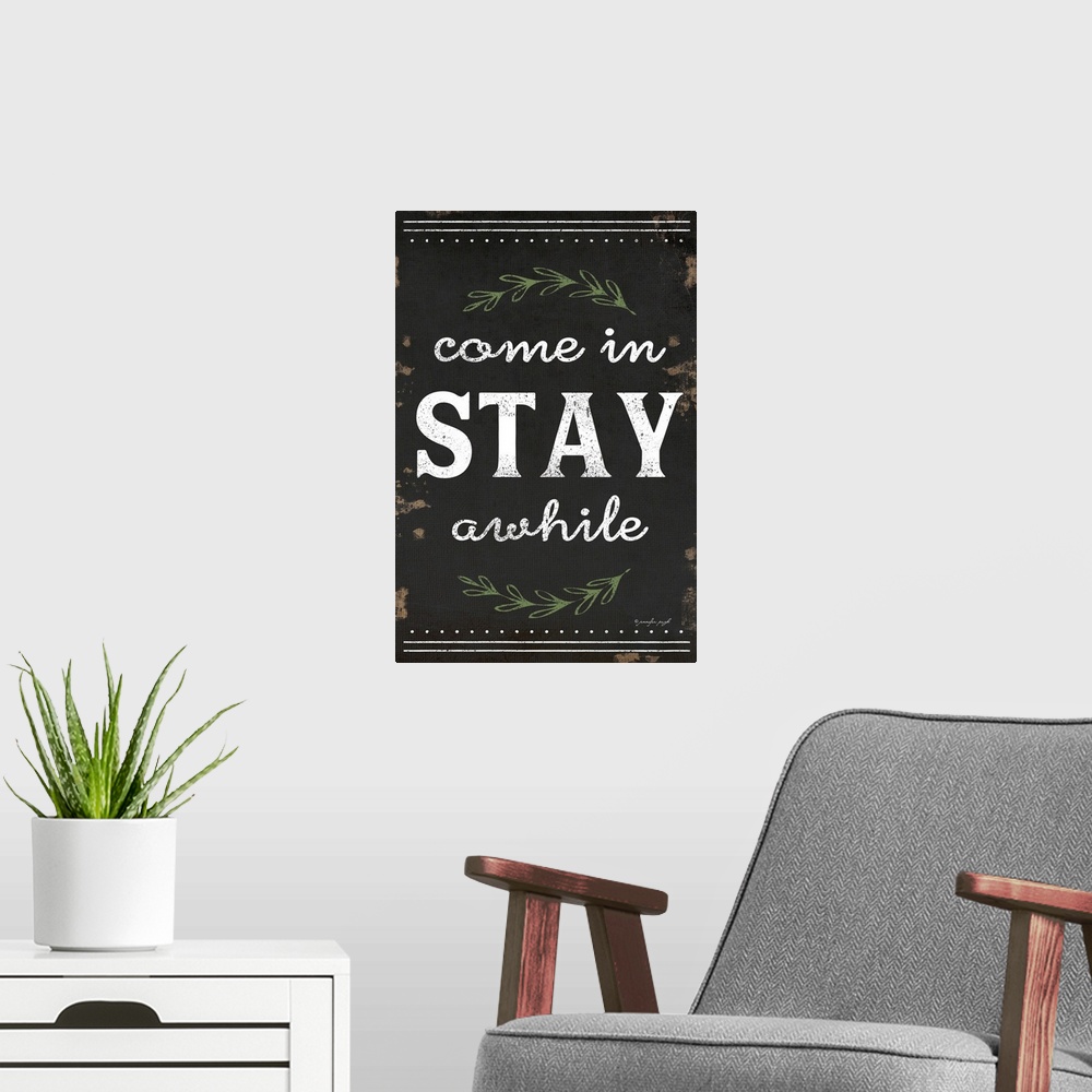 A modern room featuring A digital illustration of "Come in STAY awhile" on a weathered dark background.