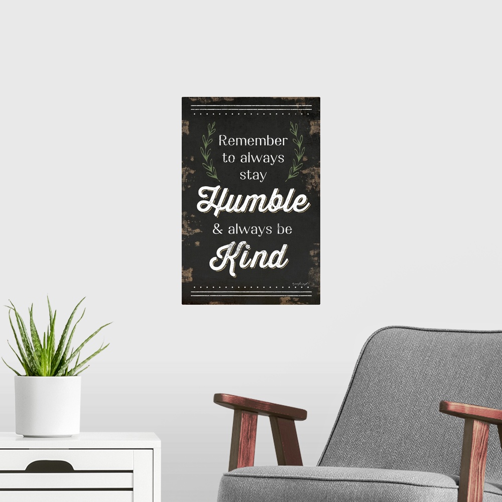 A modern room featuring "Remember to always stay Humble and always be Kind" on a weathered dark background.
