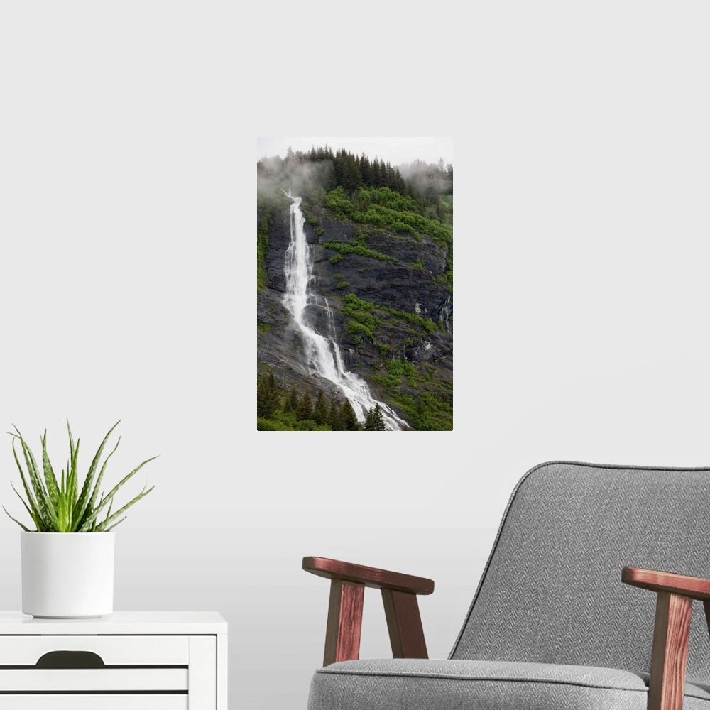 A modern room featuring USA, Alaska, Prince William Sound, waterfall in rainforest along Harriman Fiord on rainy summer a...