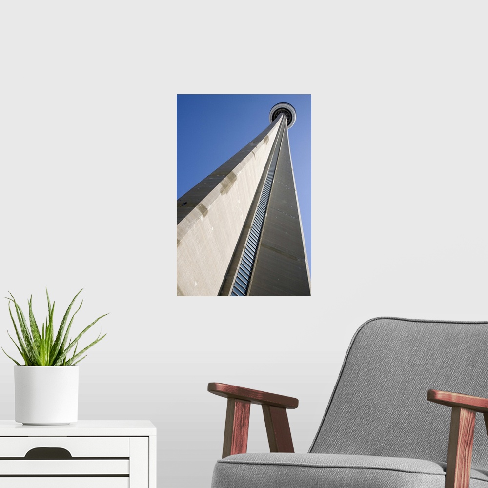 A modern room featuring Canada, Ontario, Toronto. View looking up at CN Tower, world's tallest structure of 1,815 feet. C...
