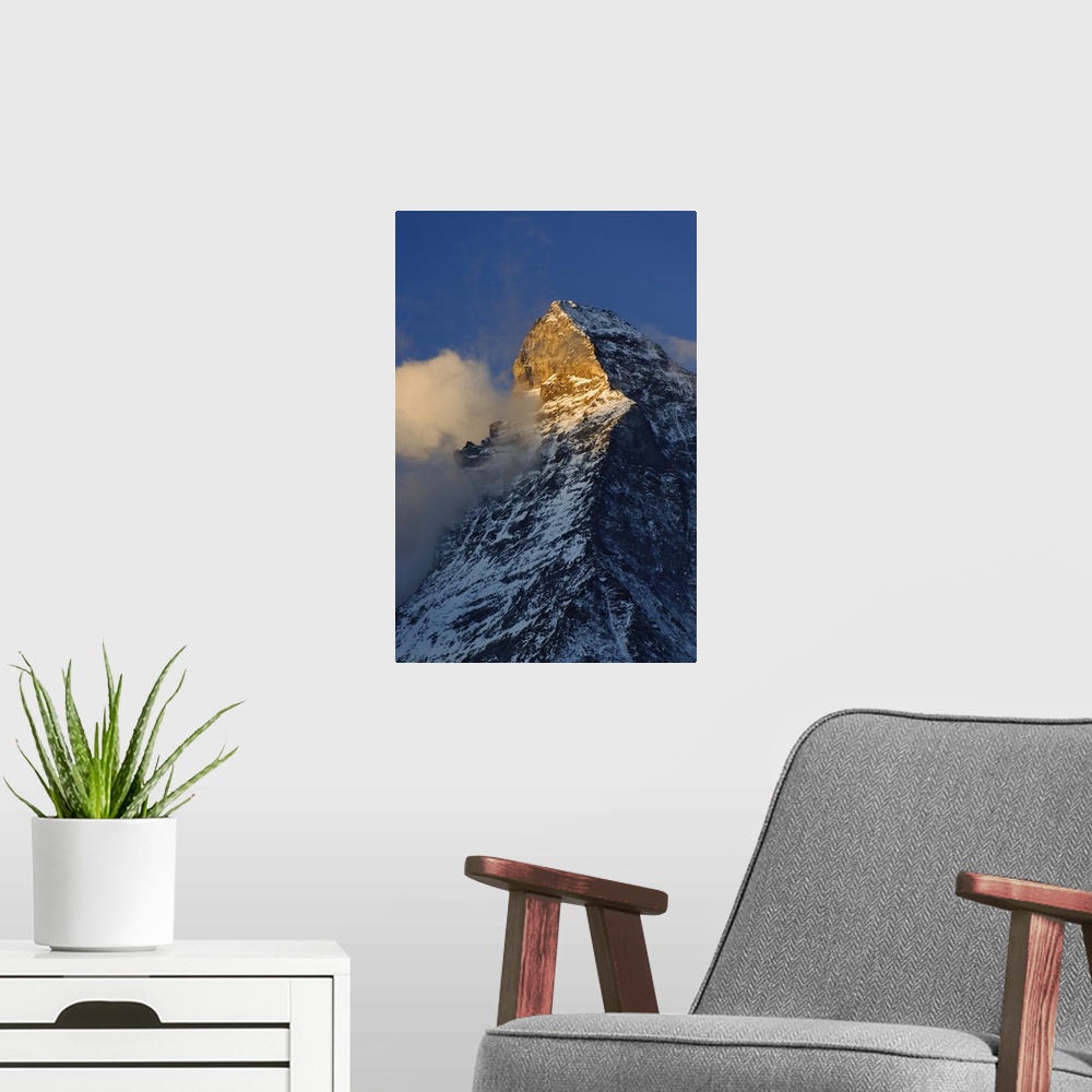 A modern room featuring Clouds around the summit of the Matterhorn at sunrise, Zermatt, Switzerland