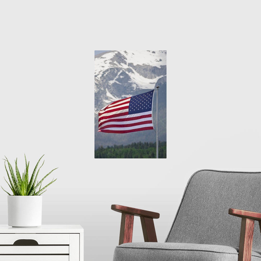 A modern room featuring USA, Colorado, Silverthorne. American flag flying against mountain backdrop.