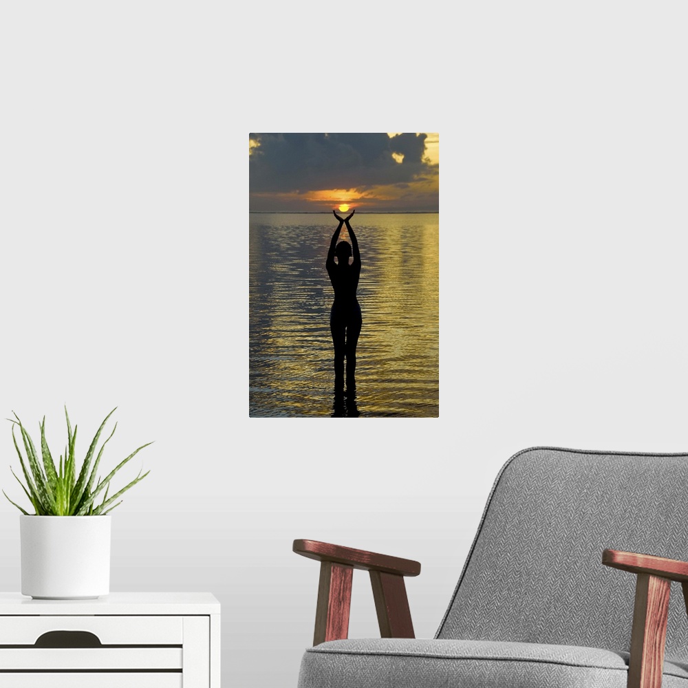 A modern room featuring Indonesia, Bali. Woman silhouetted at sunrise on Sanur Beach. Credit as: Jones-Shimlock / Jaynes ...