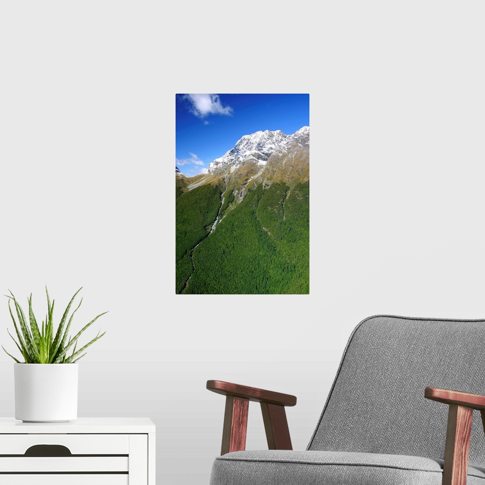 A modern room featuring Milford Sound, New Zealand. The majestic fjords, waterfalls, and imposing mountaintops in Milford...