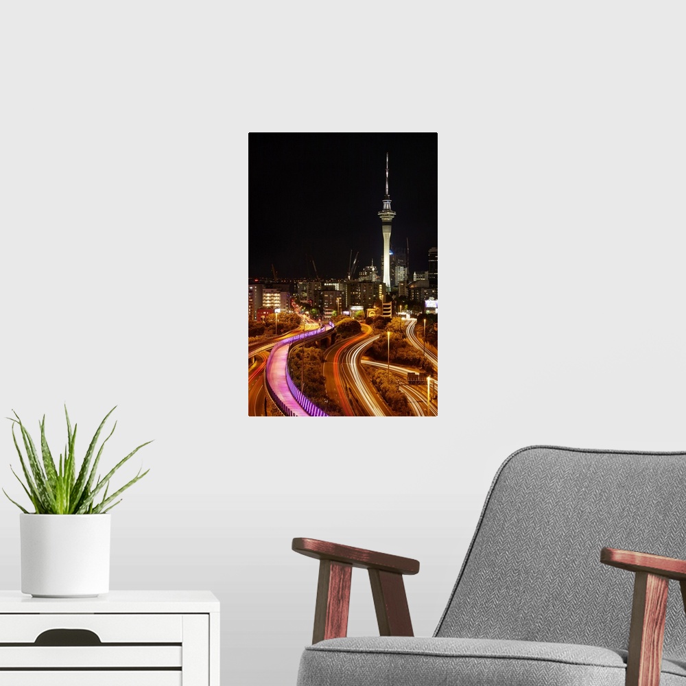 A modern room featuring Motorways, Light path cycleway, and sky tower at night, Auckland, North Island, New Zealand.