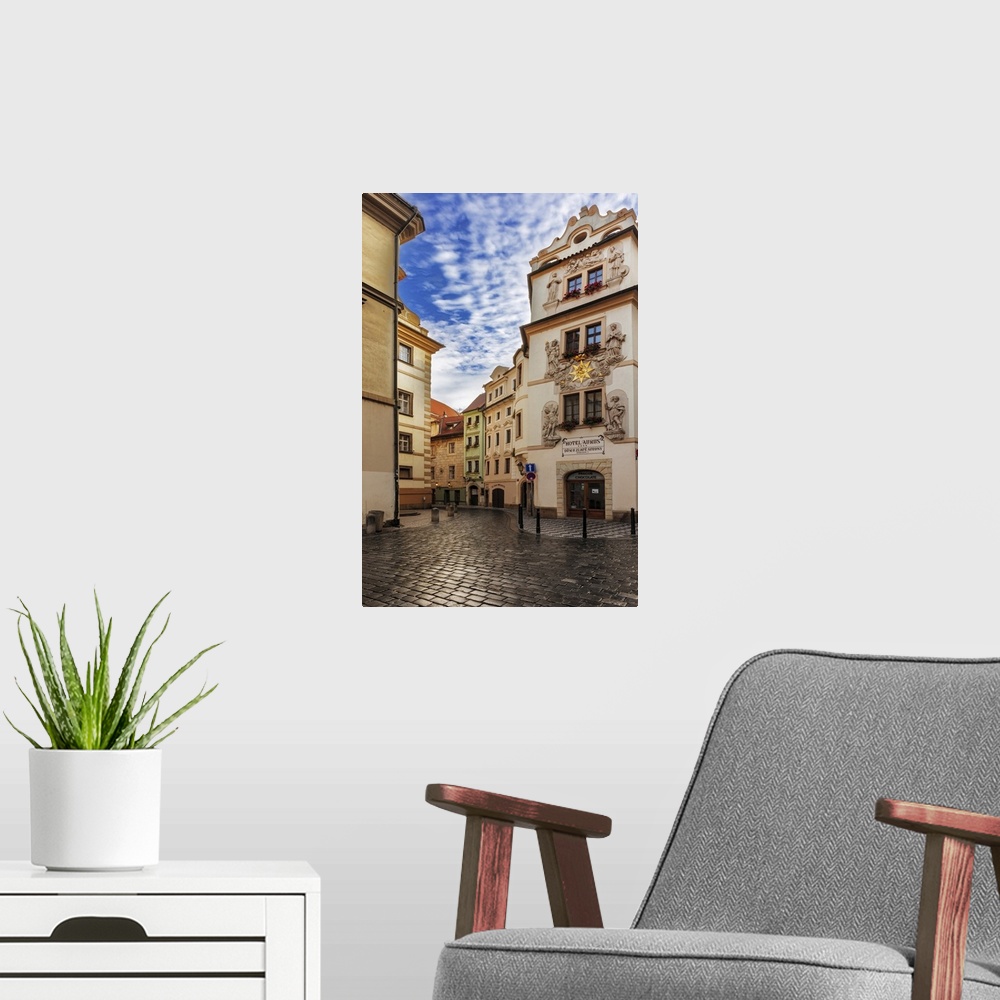 A modern room featuring Narrow wet cobblestone streets in old town in Prague, Czech republic.