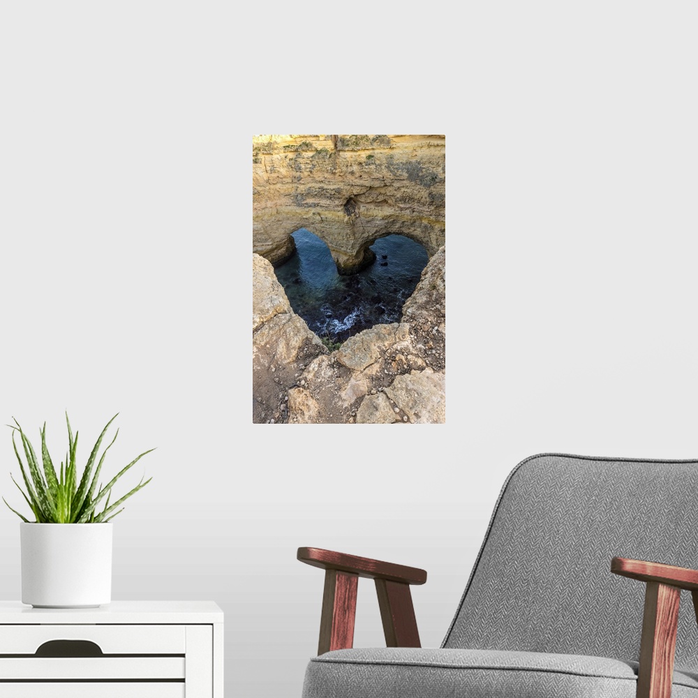 A modern room featuring Portugal. Heart-shaped rock design on shore.