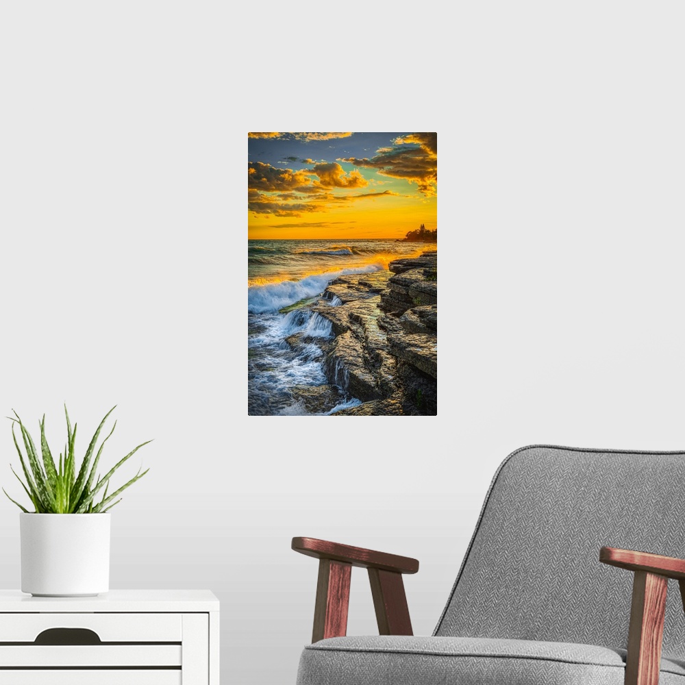 A modern room featuring USA, New York, Lake Ontario. Sunset waves on rocky shoreline. United States, New York.