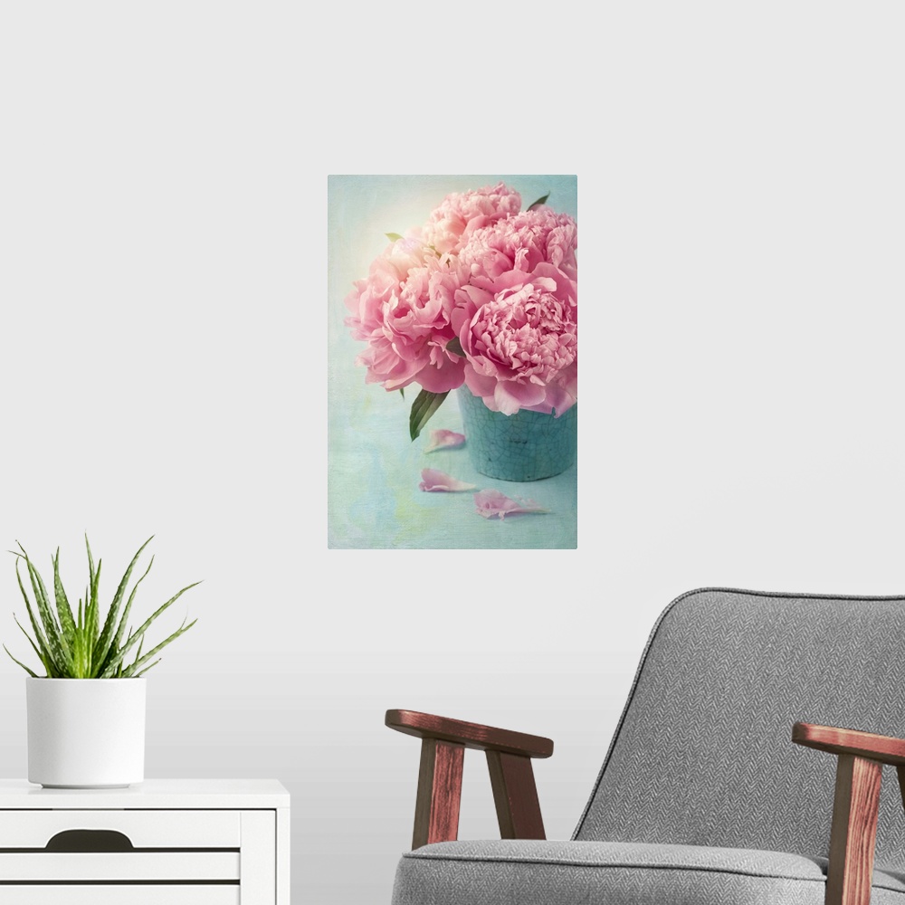 A modern room featuring Peony flowers in a vase.