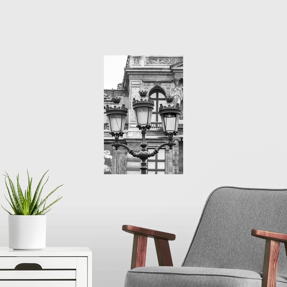 A modern room featuring Vintage street lantern detailed close-up in front of Louvre museum, Paris, France. Black and whit...