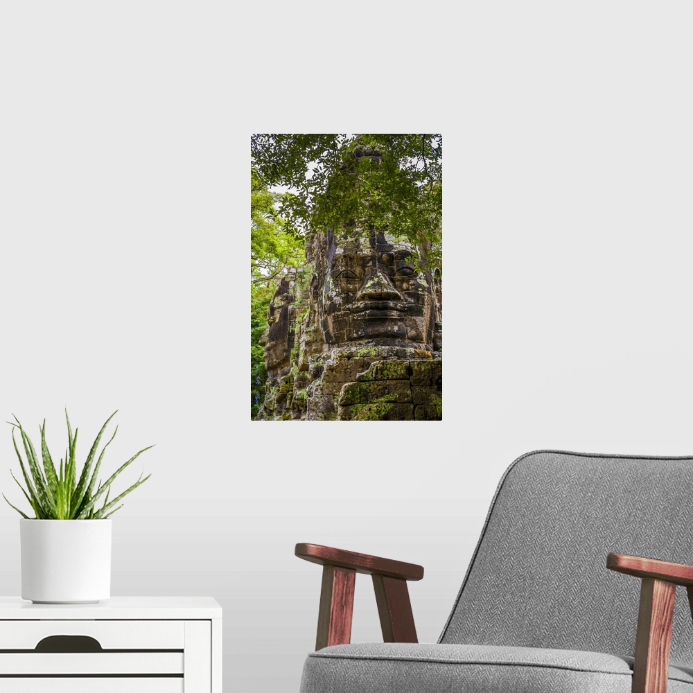 A modern room featuring Cambodia, Siem Reap, Angkor, Giant stone faces at one of the gates inside the Angkor Thom temple ...