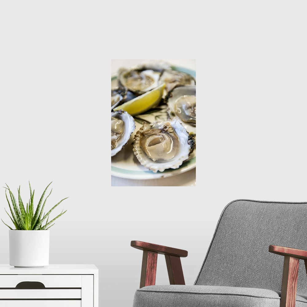 A modern room featuring UK, England, Kent, Whitstable, Oysters with lemon, Wheelers Oyster Bar.