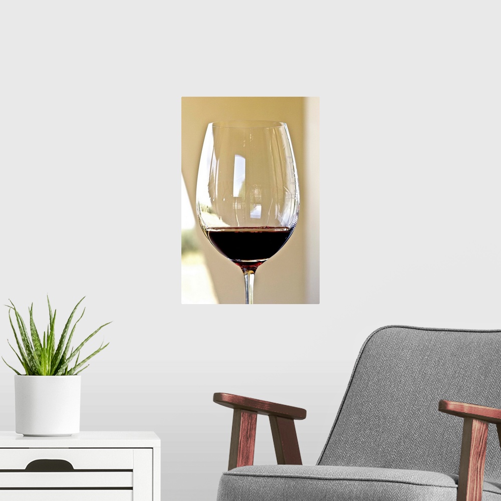 A modern room featuring Glass of red wine