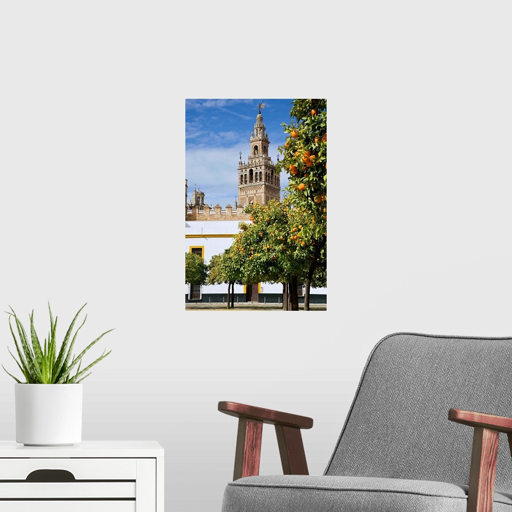 A modern room featuring Spain, Andalusia, Seville, Giralda Tower with orange trees
