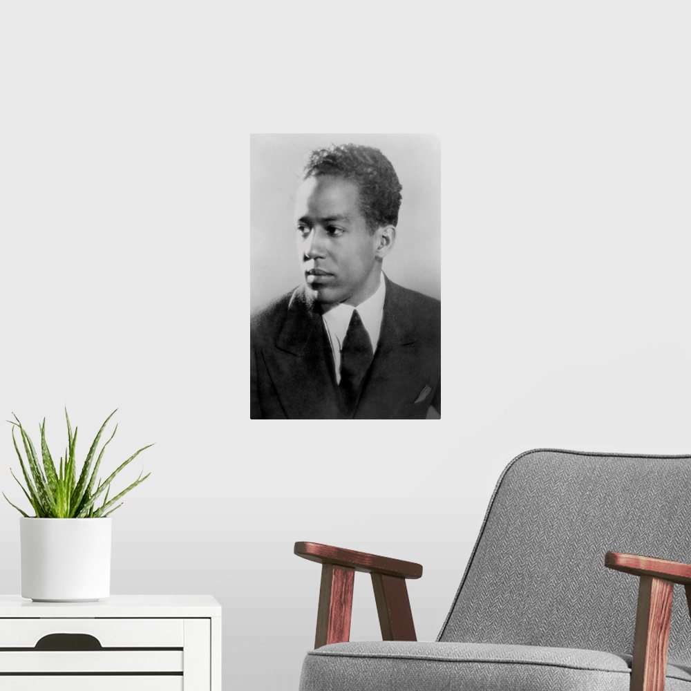 A modern room featuring Langston Hughes, African American poet, novelist, playwright, and journalist, ca. 1930.