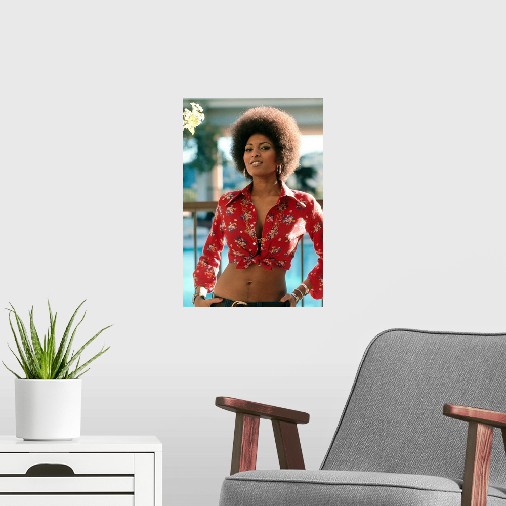 A modern room featuring Pam Grier in Coffy - Vintage Publicity Photo