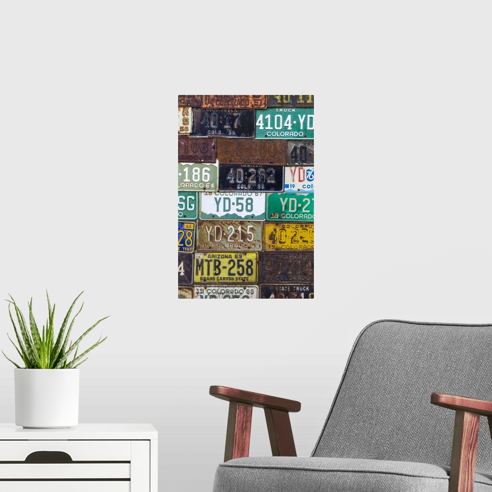 A modern room featuring A collection of vintage license plates.